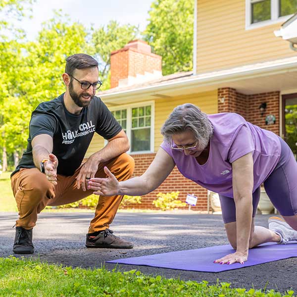 woman working out at pittsburgh home with personal trainer